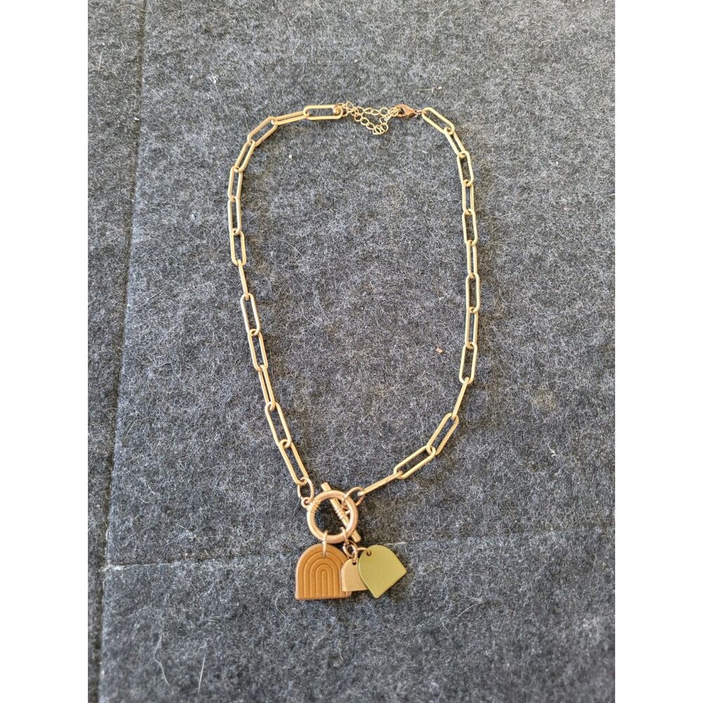 Unique Gold tone Paperclip necklace with rainbow arch charms, in good condition